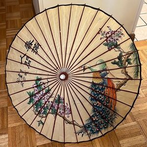 Vintage Asian wooden umbrella with beautiful graphics